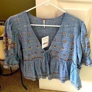 Free people Chambray, denim. Never worn. Tag retails for$128.00.